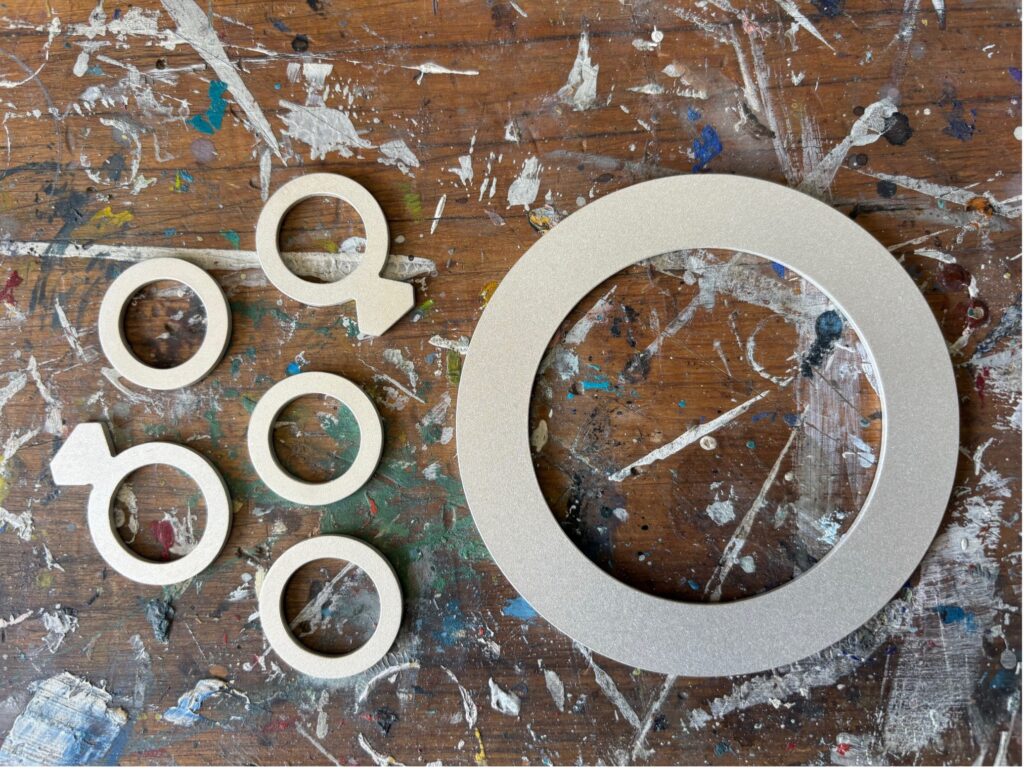 This image has an empty alt attribute; its file name is Silver-pieces-on-bench-1024x770.jpg